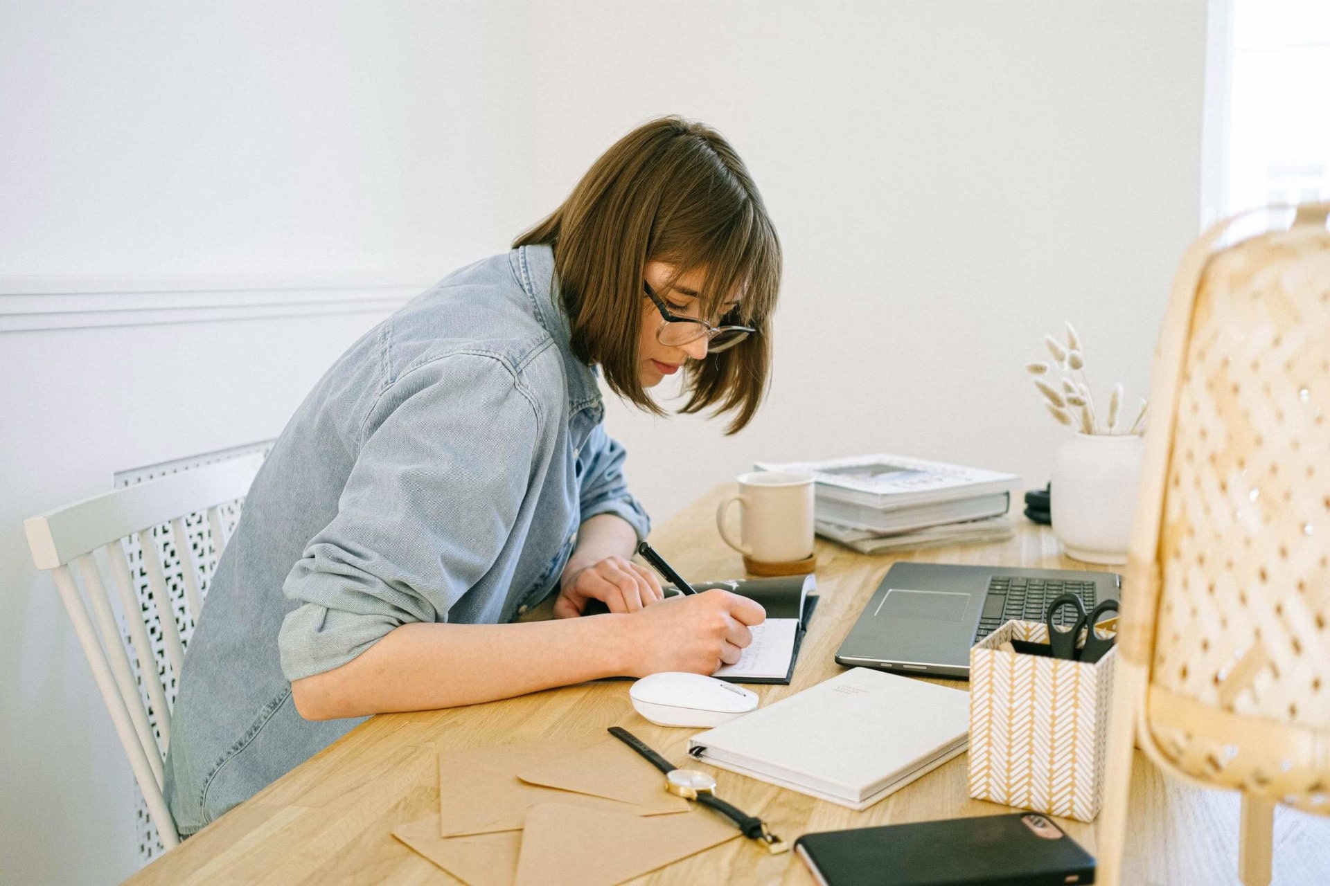 person writing on desk