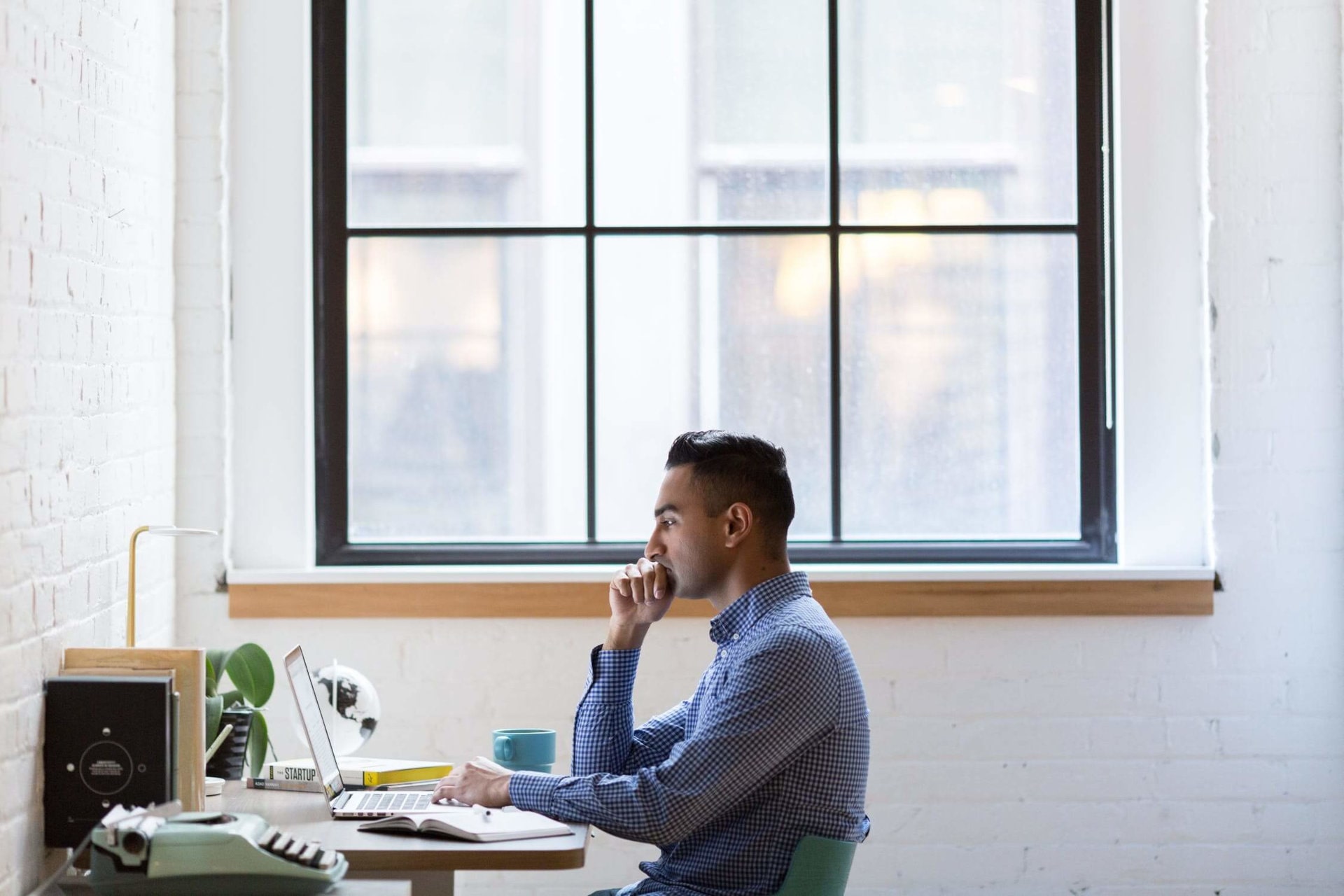 person sitting in front of a window